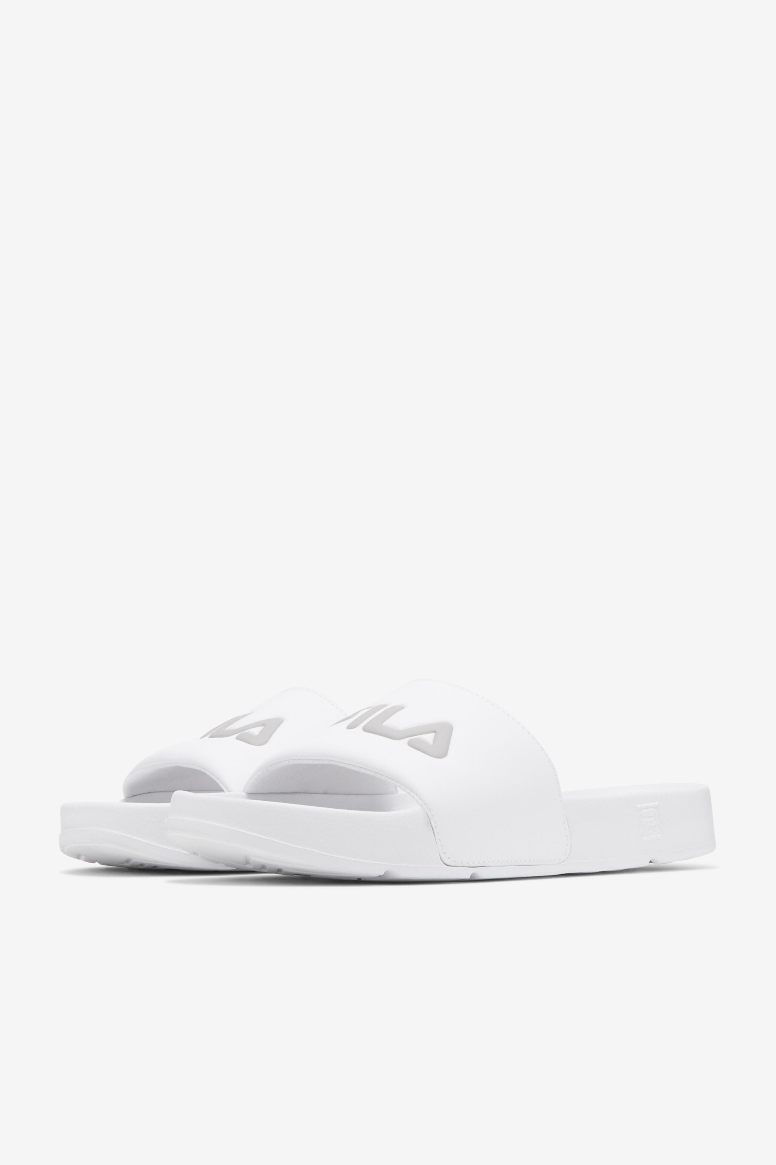 White and top gold fila slides